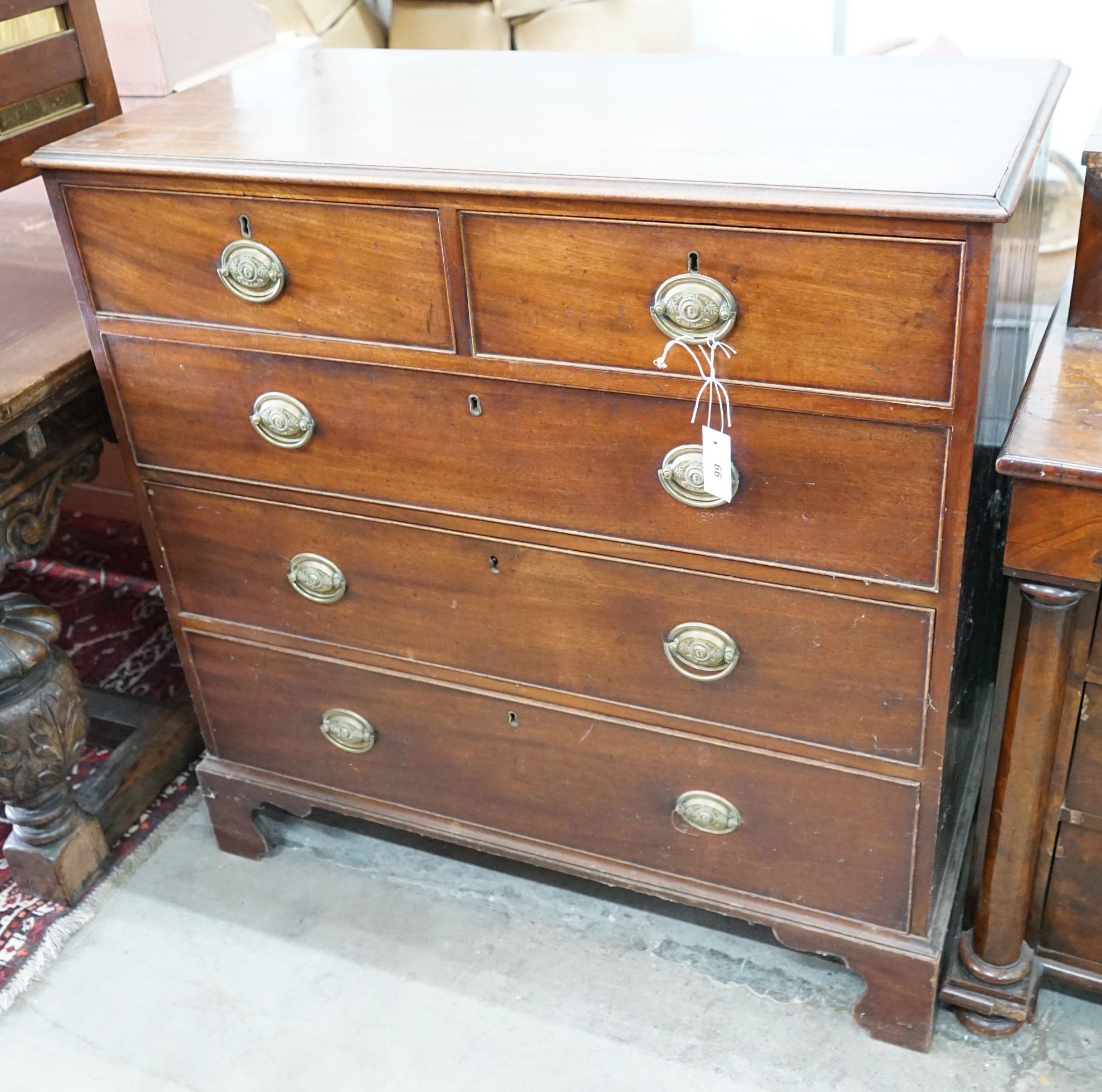 A George III mahogany straight front chest, fitted three long drawers and two short drawers, width 102cm, depth 49cm, height 102cm